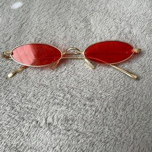 red oval sunglasses